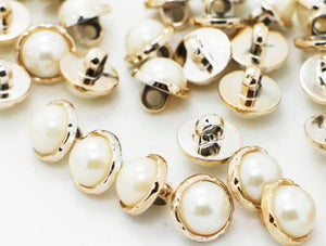 Gold pearl shank buttons.